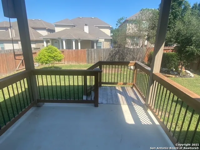 a view of a brick house with a porch