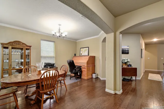 a view of a livingroom with furniture window and wooden floor