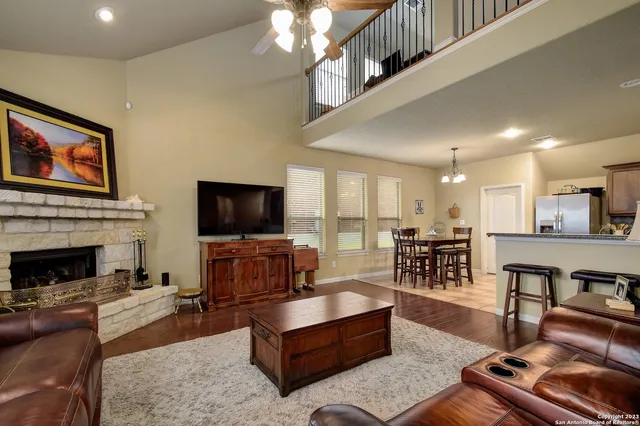 a living room with furniture and a fireplace