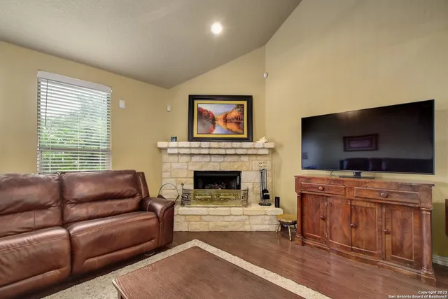 a living room with furniture and a fireplace