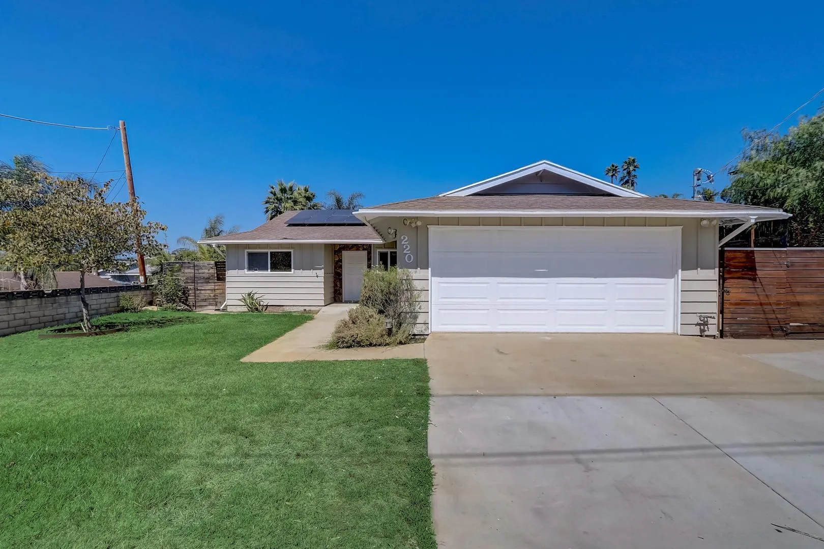 220 Shetland Way Fallbrook, CA 92028 - Photo 1 of 24 a front view of a house with a yard