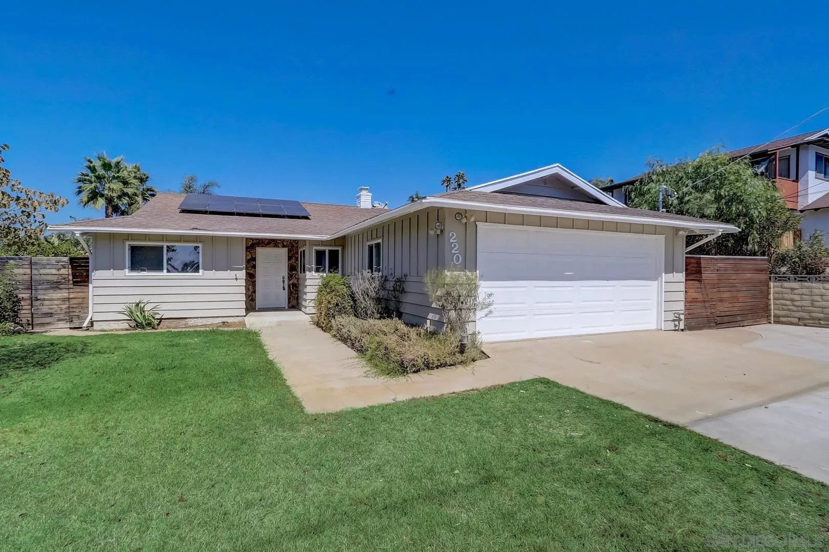 220 Shetland Way Fallbrook, CA 92028 - Photo 12 of 24 a front view of a house with a garden