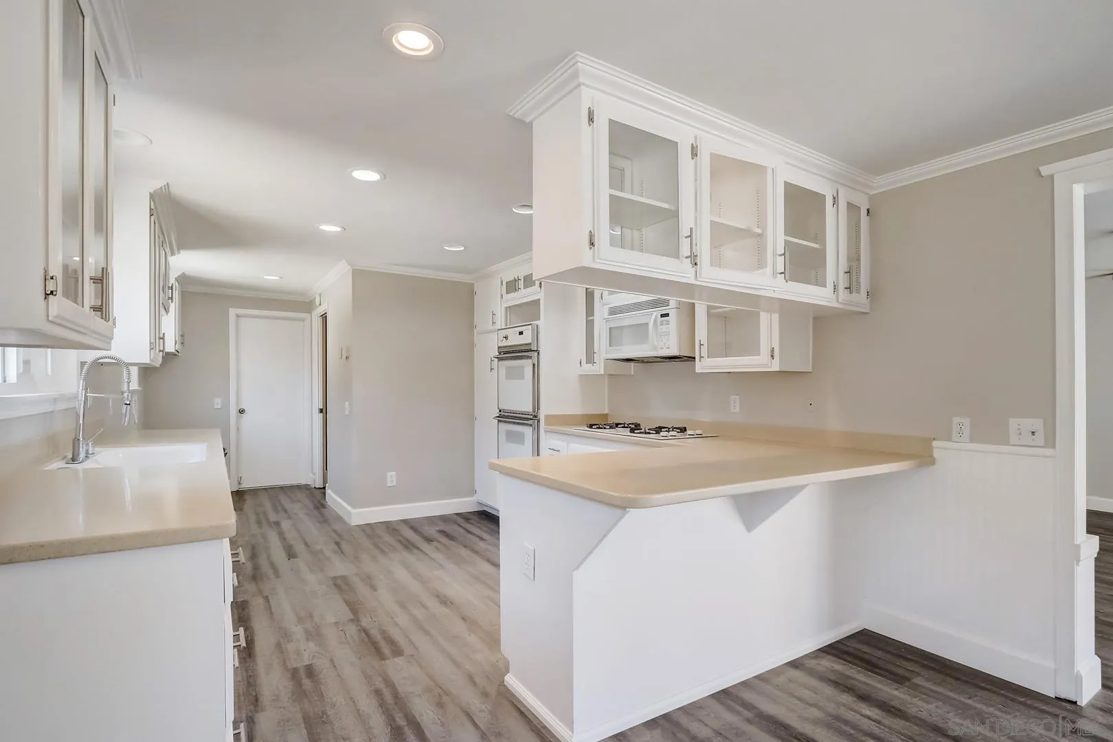 220 Shetland Way Fallbrook, CA 92028 - Photo 14 of 24 a kitchen with stainless steel appliances granite countertop a sink stove and refrigerator