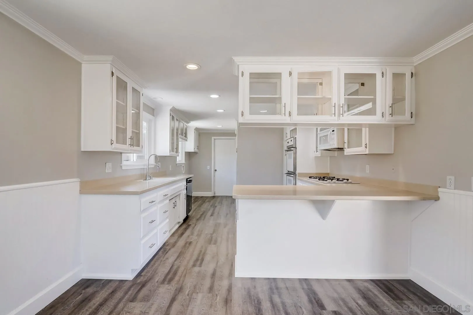 220 Shetland Way Fallbrook, CA 92028 - Photo 15 of 24 a large kitchen with granite countertop a large counter top space and stainless steel appliances