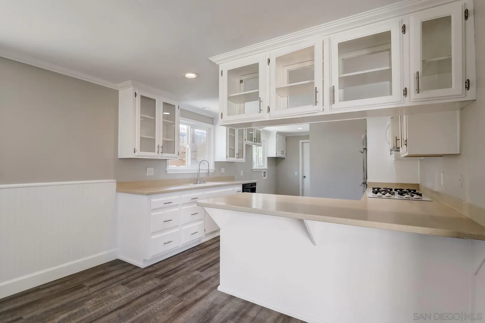 220 Shetland Way Fallbrook, CA 92028 - Photo 16 of 24 a kitchen with granite countertop a sink and cabinets