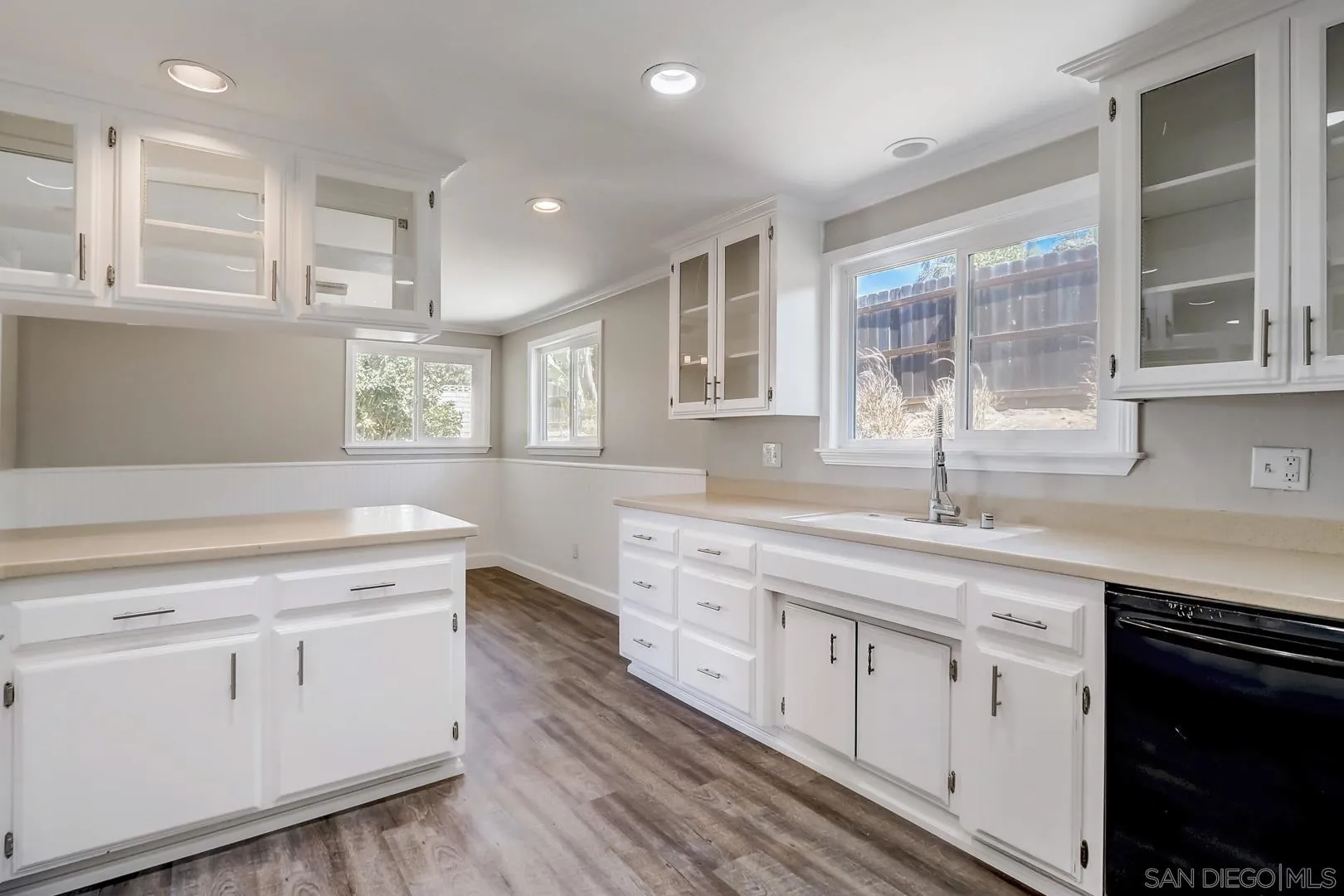 220 Shetland Way Fallbrook, CA 92028 - Photo 17 of 24 a kitchen with white cabinets and sink