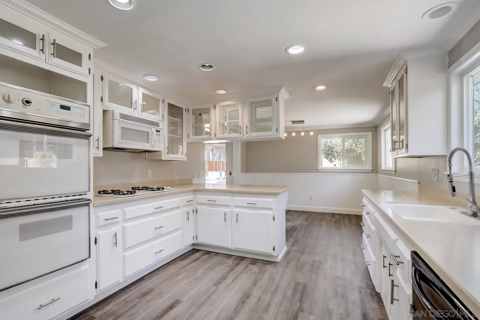 220 Shetland Way Fallbrook, CA 92028 - Photo 4 of 24 a kitchen with stainless steel appliances granite countertop a sink stove and refrigerator