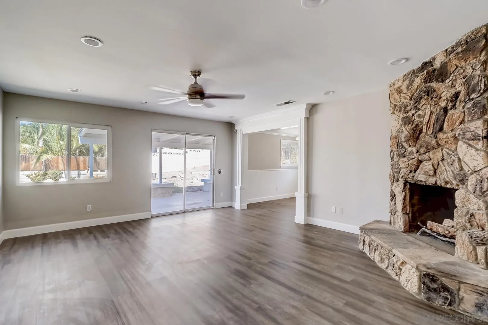 220 Shetland Way Fallbrook, CA 92028 - Photo 6 of 24 wooden floor in an empty room with a fireplace