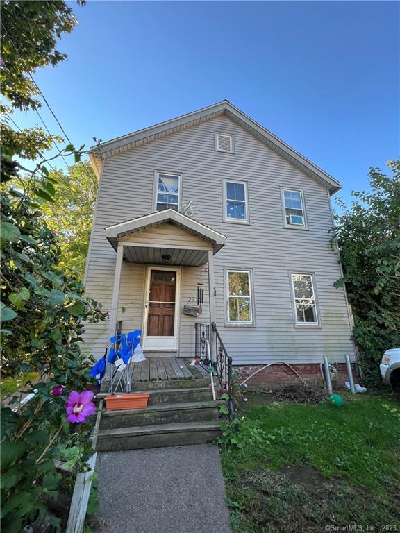 27 Connerton Street New Britain, CT 06051 - Photo 2 of 22 a front view of a house with a yard