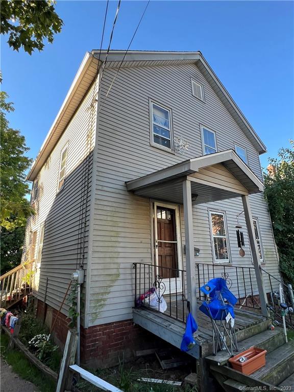 27 Connerton Street New Britain, CT 06051 - Photo 3 of 22 a front view of a house with yard
