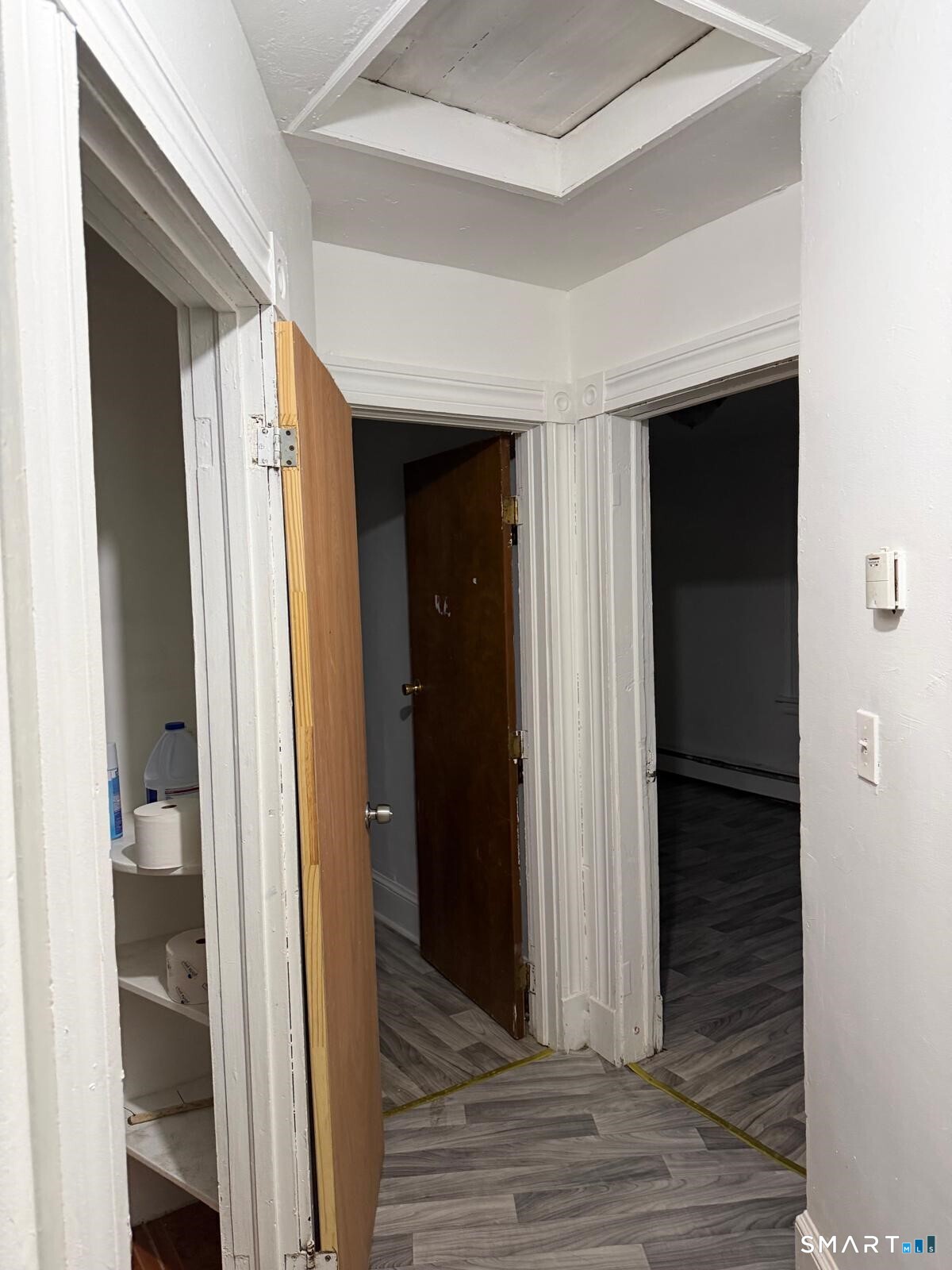 27 Connerton Street New Britain, CT 06051 - Photo 5 of 22 a view of a hallway with wooden floor and closet