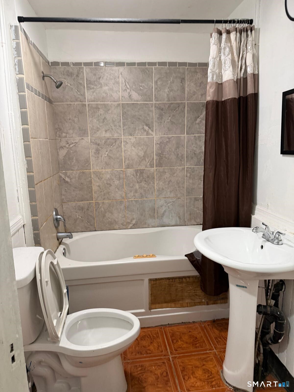 27 Connerton Street New Britain, CT 06051 - Photo 8 of 22 a bathroom with a sink toilet and shower