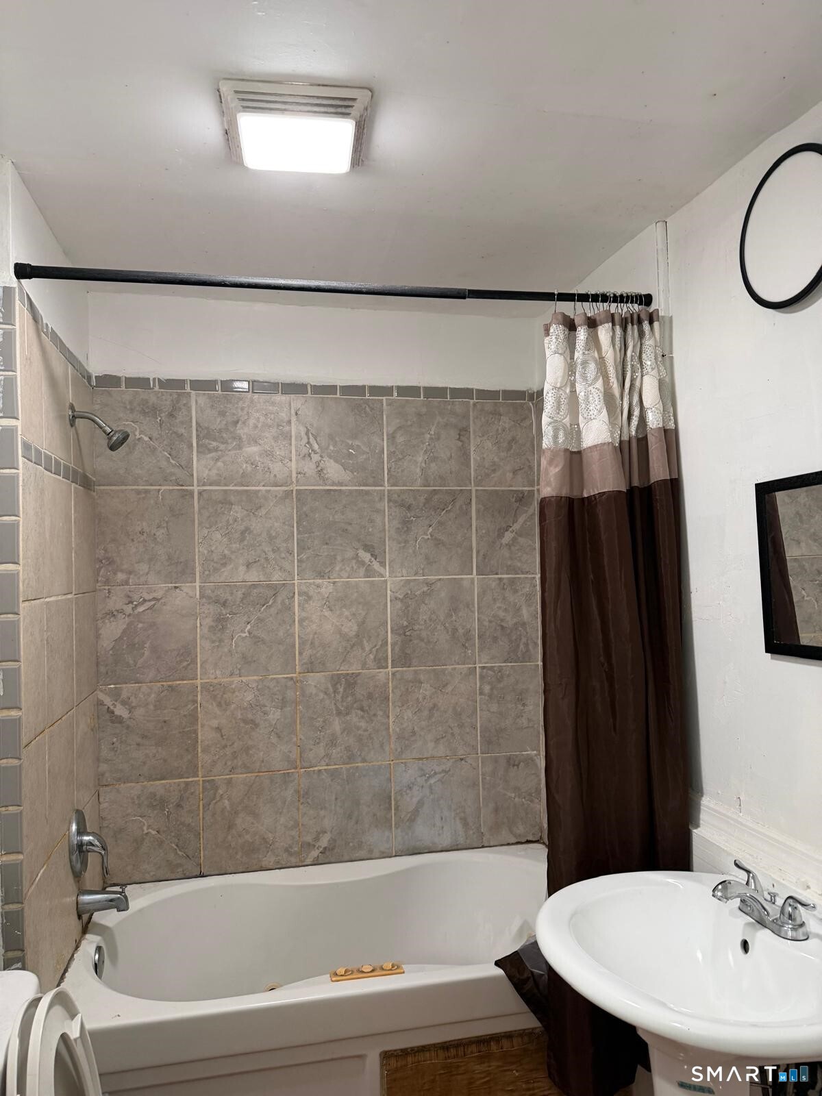 27 Connerton Street New Britain, CT 06051 - Photo 9 of 22 a bathroom with a sink and a mirror