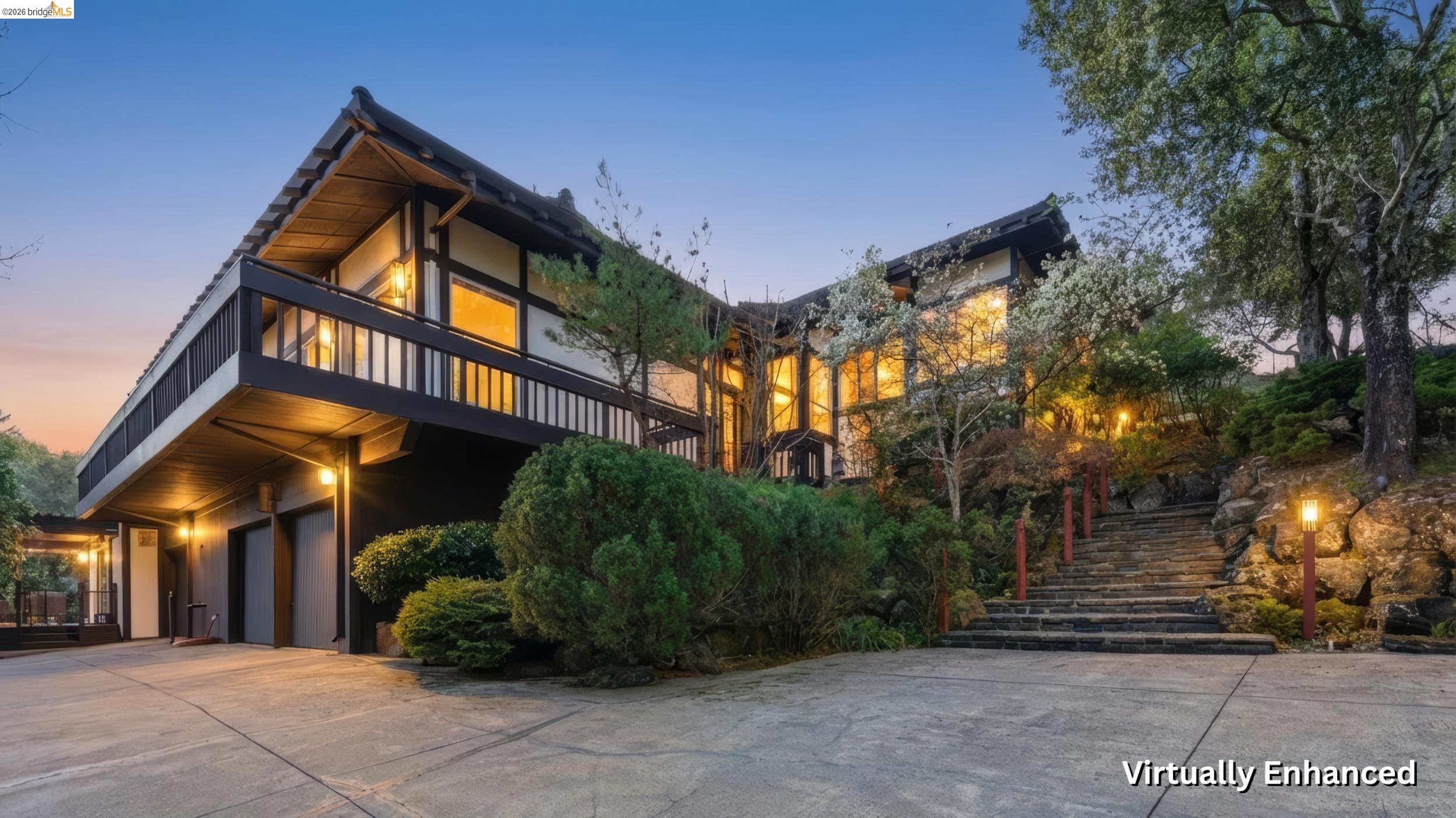 View of front of house featuring concrete driveway, a balcony, a garage, and stucco siding