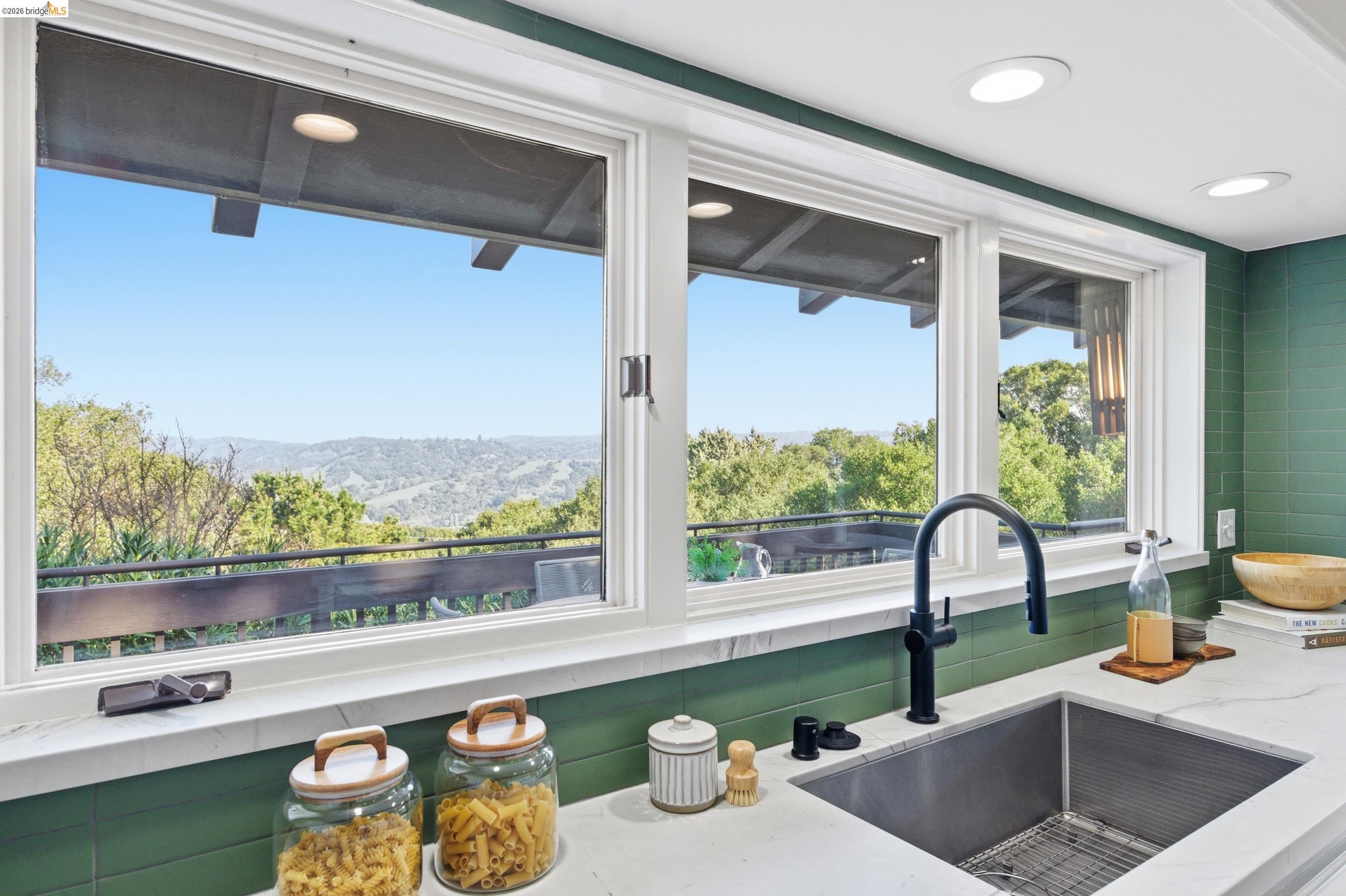 271 Monte Vista Ridge Road Orinda, CA 94563 - Photo 15 of 59 Kitchen view of light stone countertops and a mountain backdrop