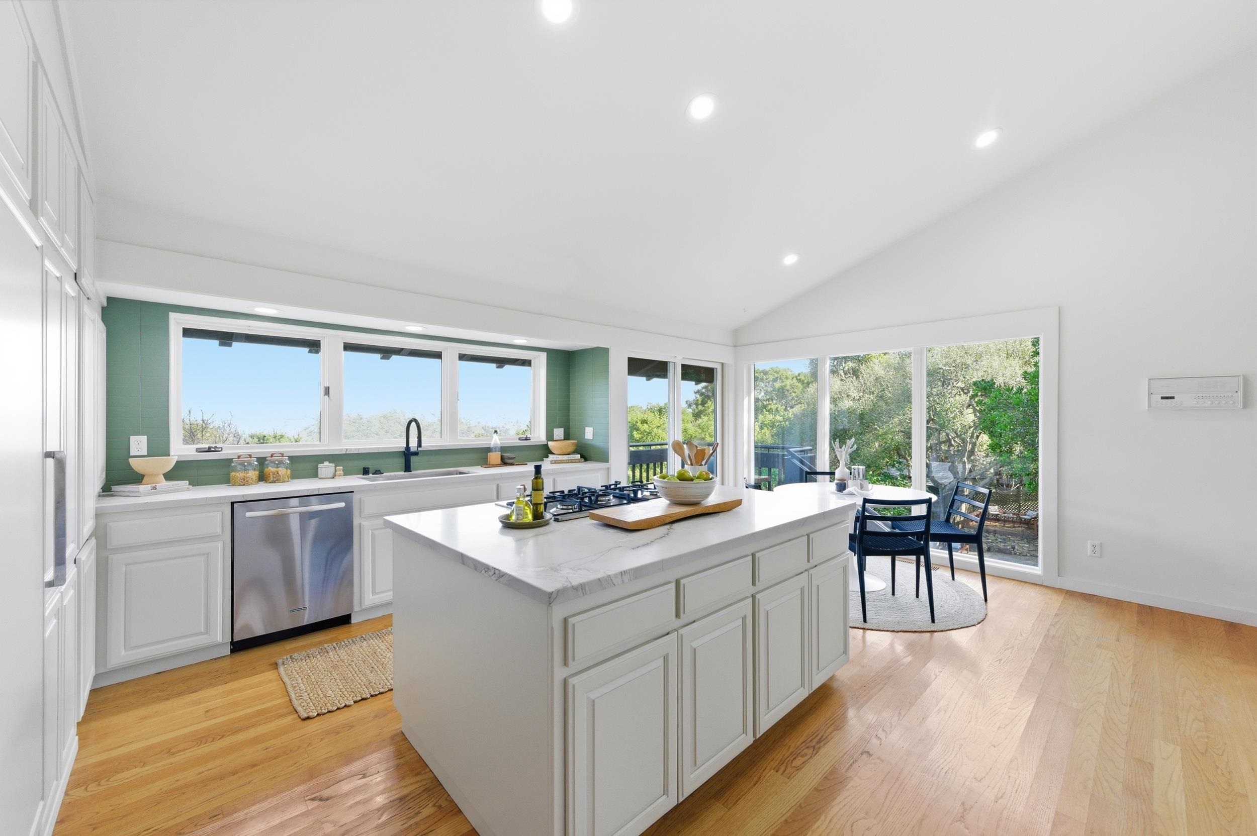 271 Monte Vista Ridge Road Orinda, CA 94563 - Photo 16 of 59 Kitchen with white cabinetry, recessed lighting, lofted ceiling, stainless steel appliances, and light wood-style floors