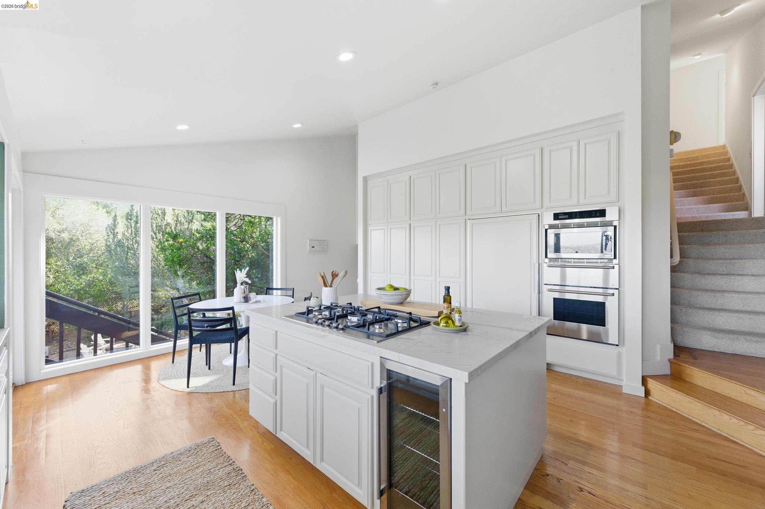 271 Monte Vista Ridge Road Orinda, CA 94563 - Photo 17 of 59 a kitchen with a stove a refrigerator and chairs