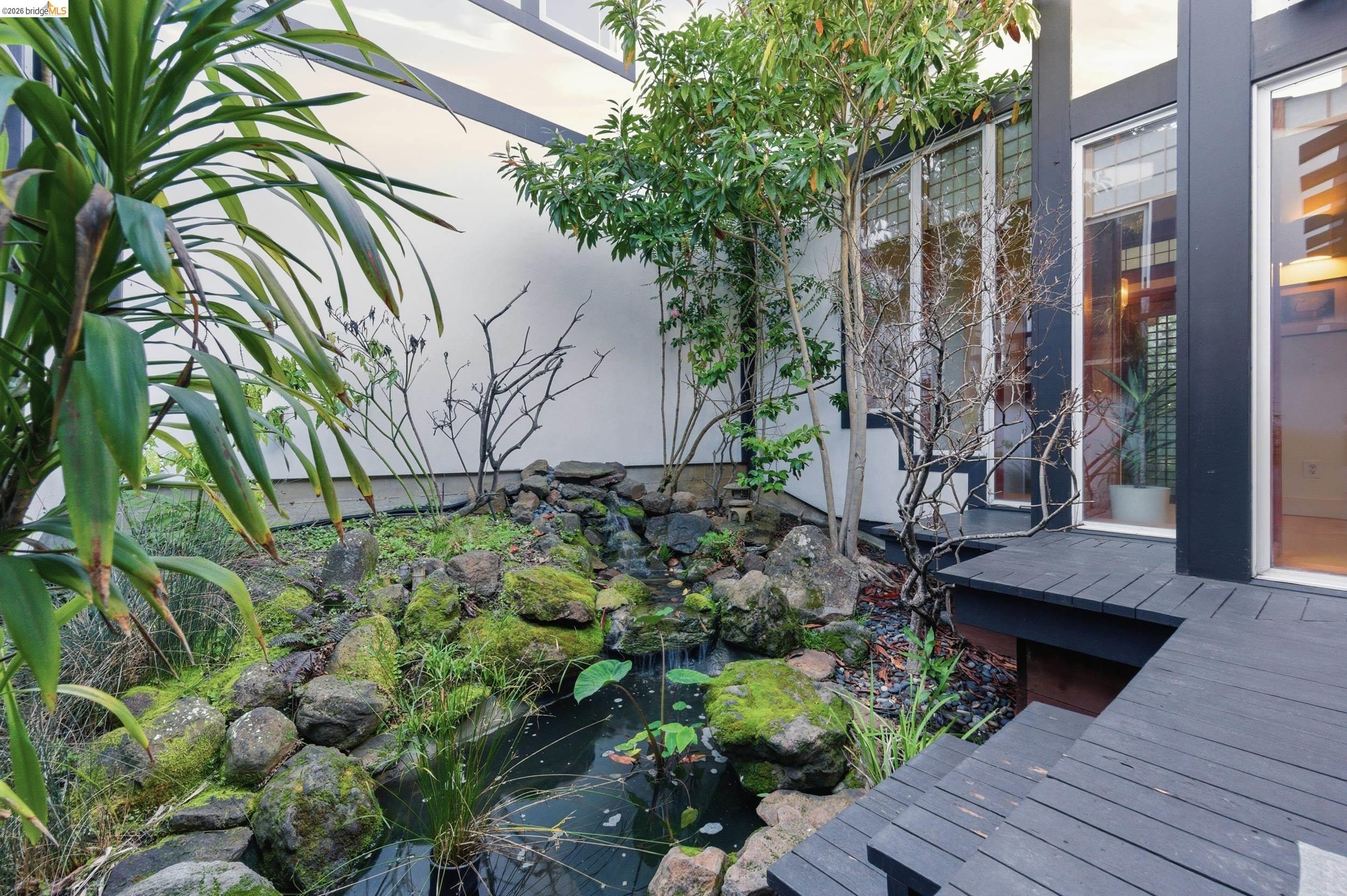 271 Monte Vista Ridge Road Orinda, CA 94563 - Photo 26 of 59 Exterior view of a small pond and stucco siding