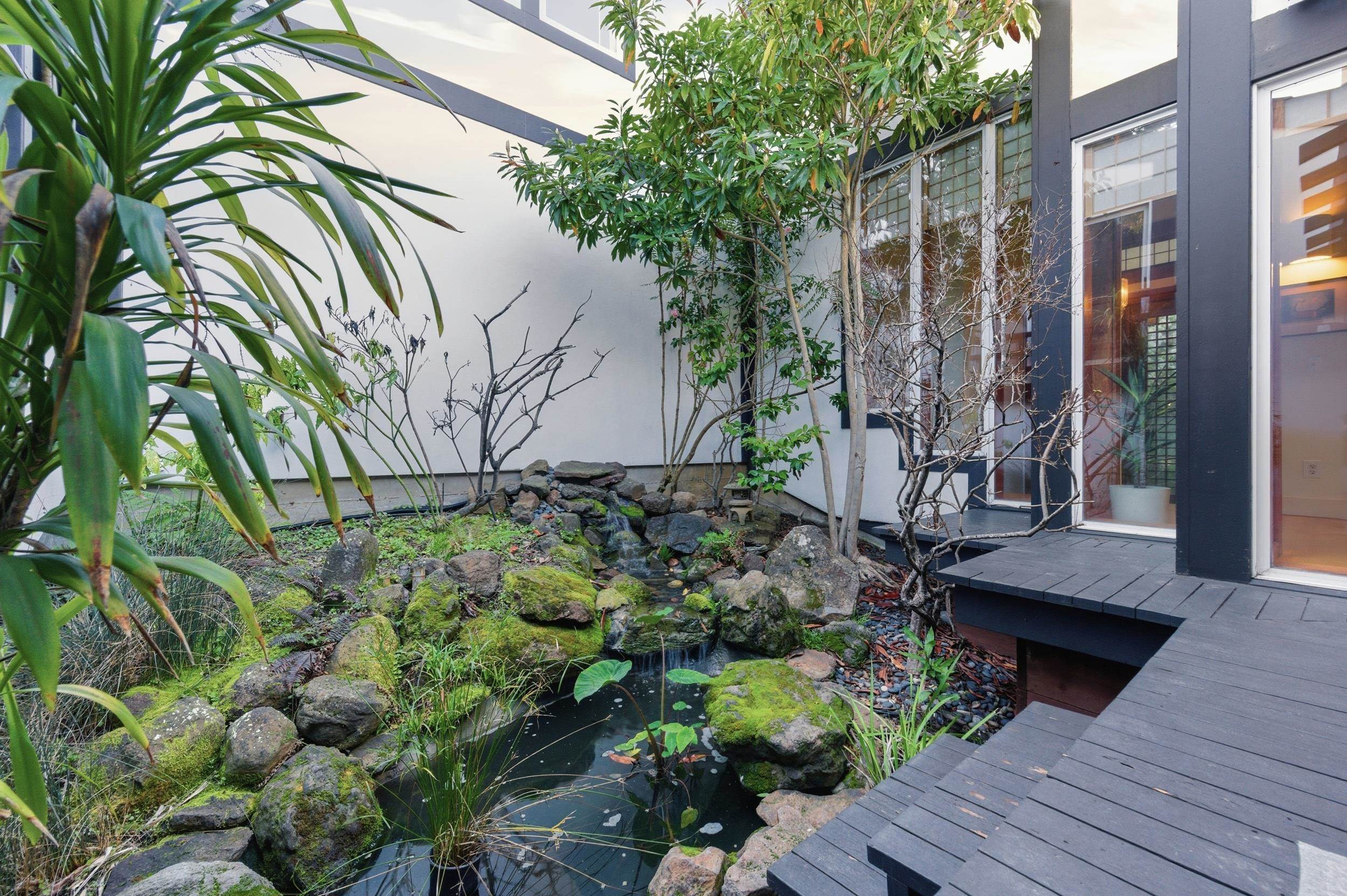 271 Monte Vista Ridge Road Orinda, CA 94563 - Photo 26 of 59 Exterior view of a small pond and stucco siding