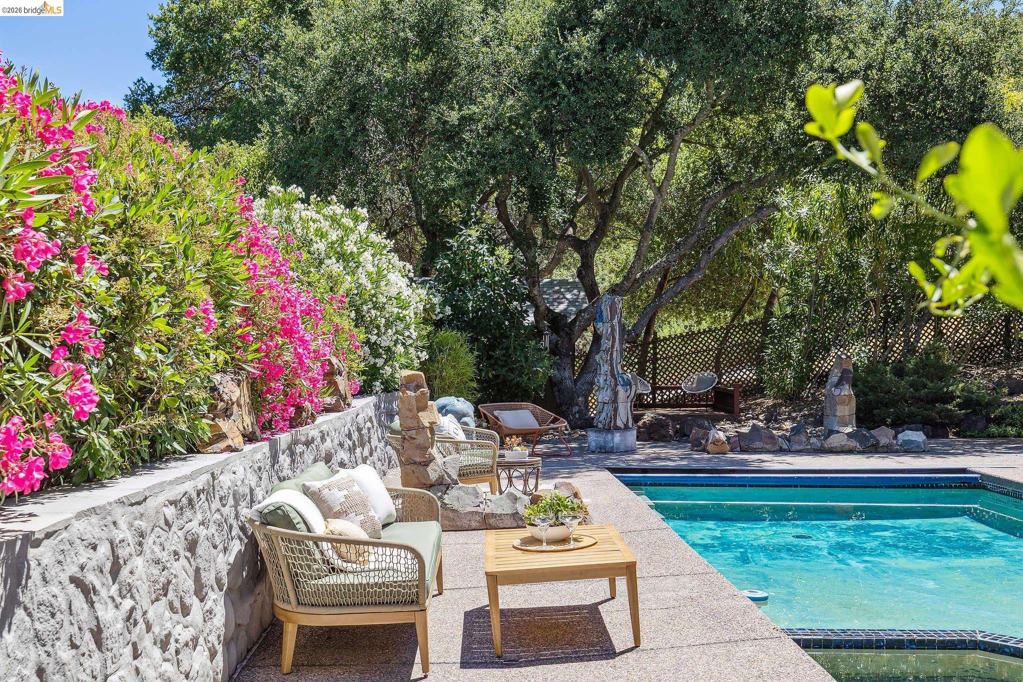 271 Monte Vista Ridge Road Orinda, CA 94563 - Photo 41 of 59 a view of a patio with table and chairs and potted plants