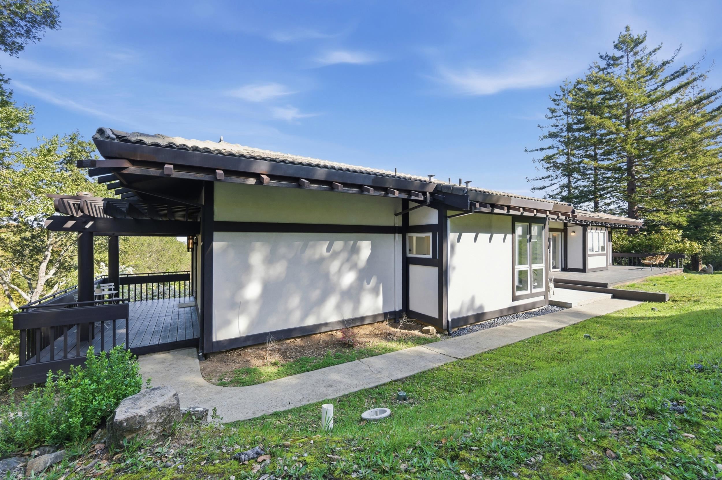 271 Monte Vista Ridge Road Orinda, CA 94563 - Photo 51 of 59 View of home's exterior featuring stucco siding, a deck, a tiled roof, and a yard