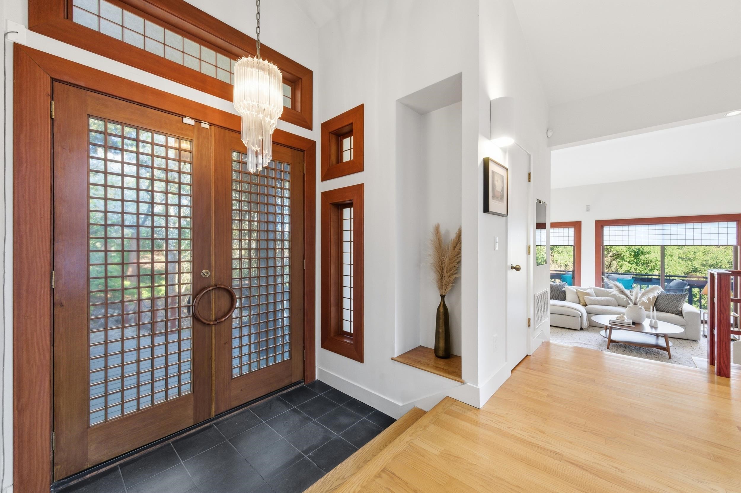 271 Monte Vista Ridge Road Orinda, CA 94563 - Photo 8 of 59 Foyer entrance with a high ceiling, dark tile patterned flooring, and suspended lighting