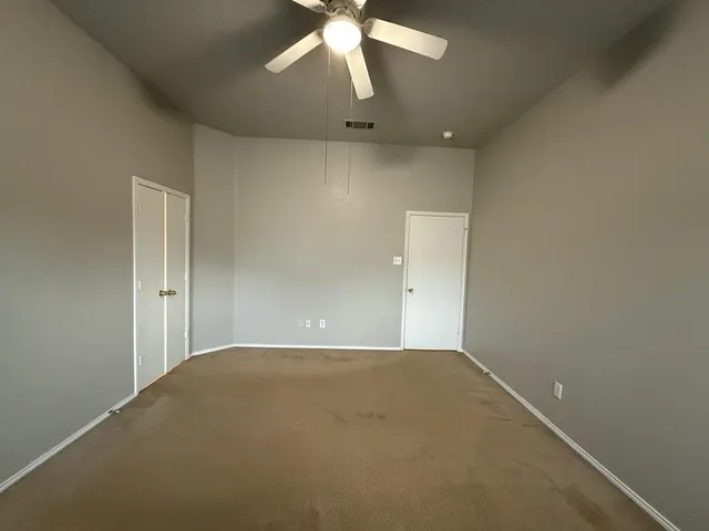 an empty room that has a window in it