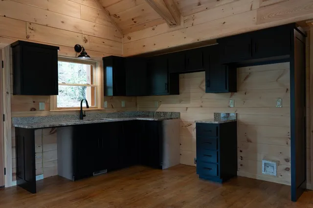 a view of kitchen with furniture and window