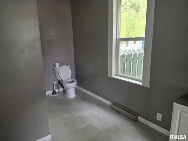 a bathroom with a toilet