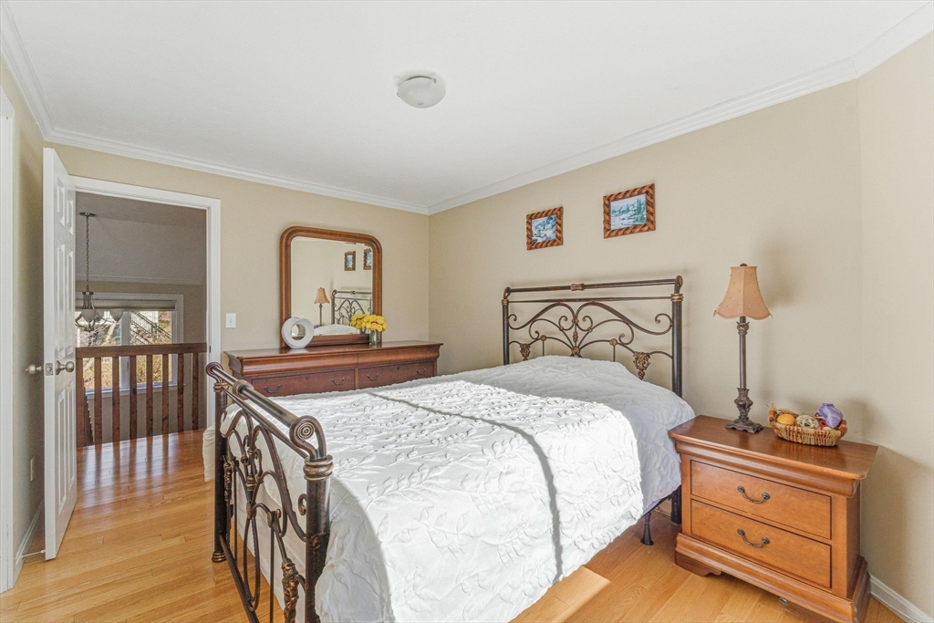 3 Heather Hill Road Acton, MA 01720 - Photo 21 of 33 a bedroom with a bed and a table