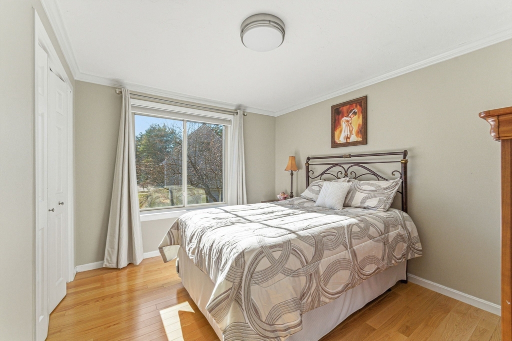 3 Heather Hill Road Acton, MA 01720 - Photo 23 of 33 a bedroom with a bed and a window