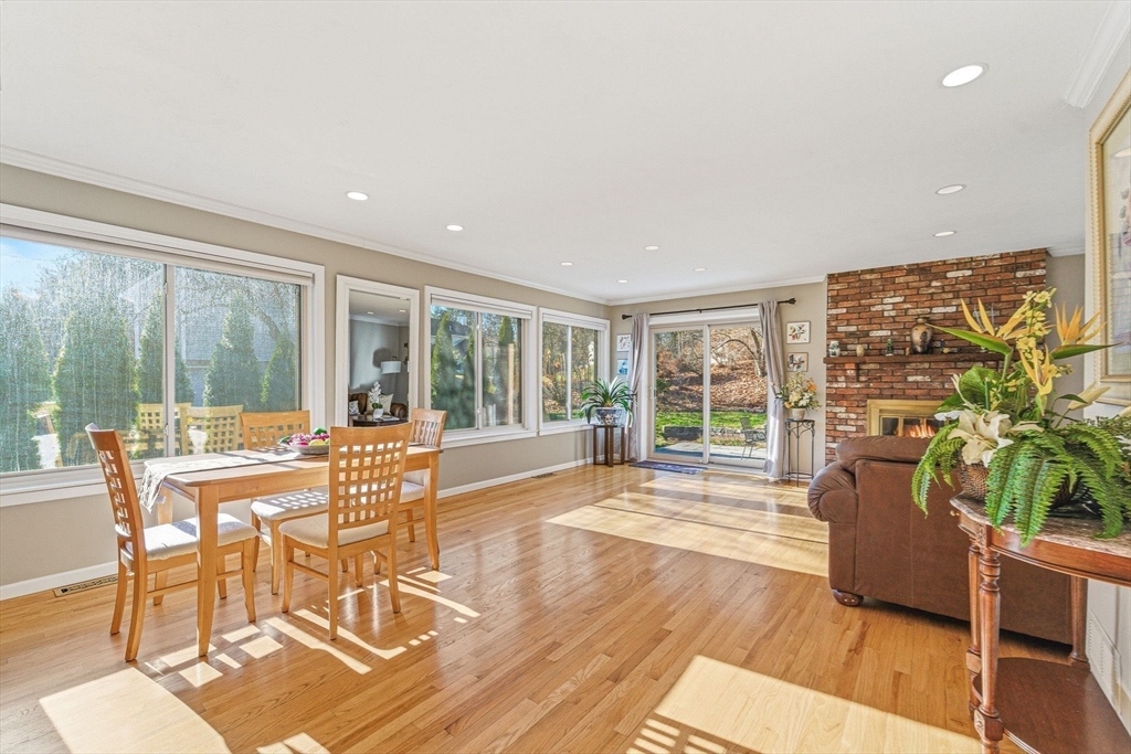 3 Heather Hill Road Acton, MA 01720 - Photo 6 of 33 a dining room with furniture a chandelier and wooden floor