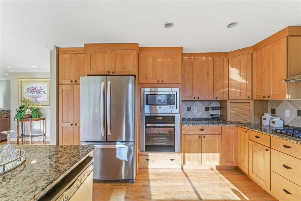 3 Heather Hill Road Acton, MA 01720 - Photo 7 of 33 a kitchen with stainless steel appliances granite countertop a refrigerator and stove