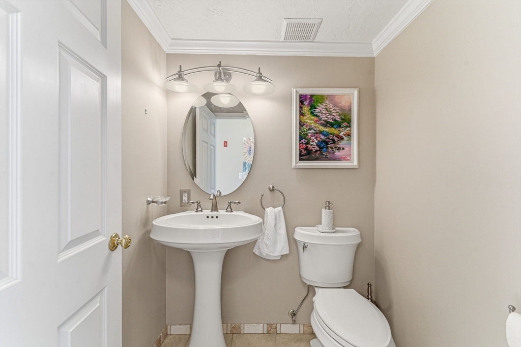 3 Heather Hill Road Acton, MA 01720 - Photo 10 of 33 a bathroom with a toilet sink and mirror