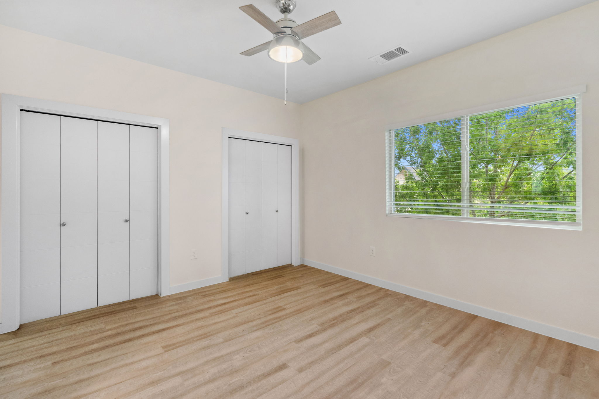 7805 Cooper Lane, Unit 606 Austin, TX 78745 - Photo 20 of 35 a view of empty room with wooden floor and fan