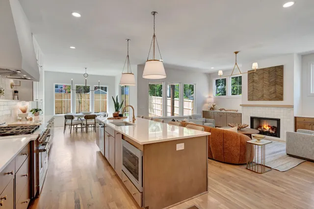 a living room with furniture and stairs
