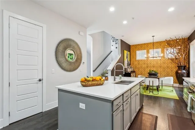 a utility room with sink and a window