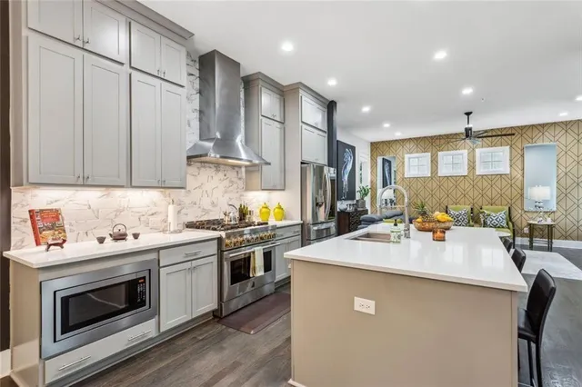 a kitchen with a stove a sink and a refrigerator