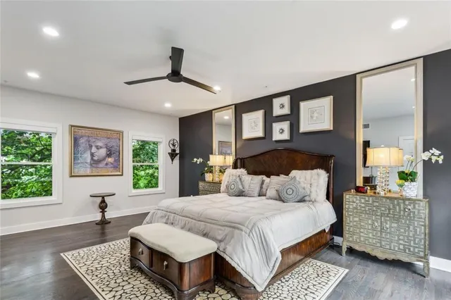 a bedroom with a large bed and a window