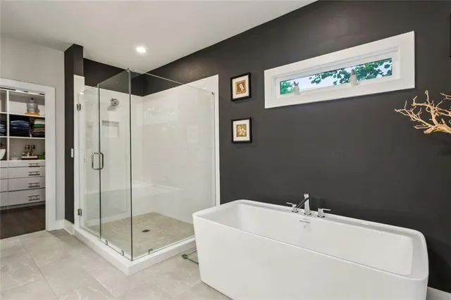 a bathroom with a shower and a sink