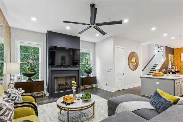 a living room with fireplace furniture and a fireplace