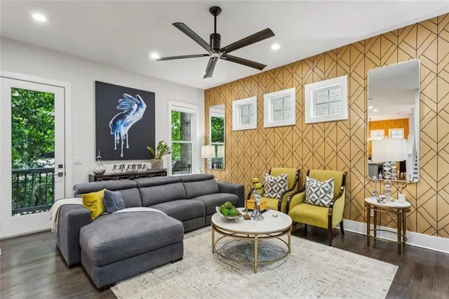 a living room with furniture and a large window