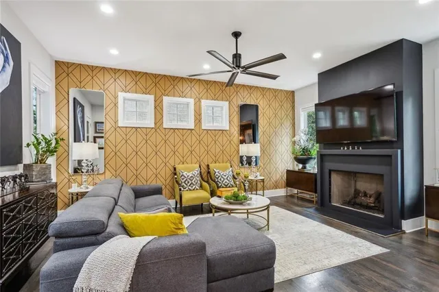 a living room with furniture and a fireplace