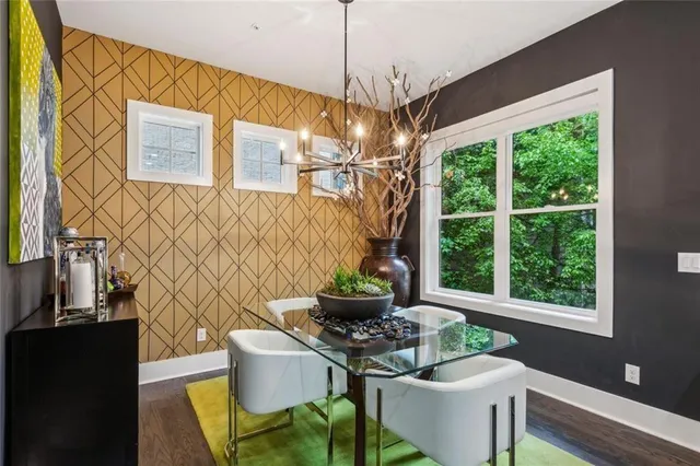 a dining room with furniture and window