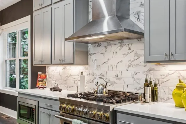 a kitchen with a stove and cabinets