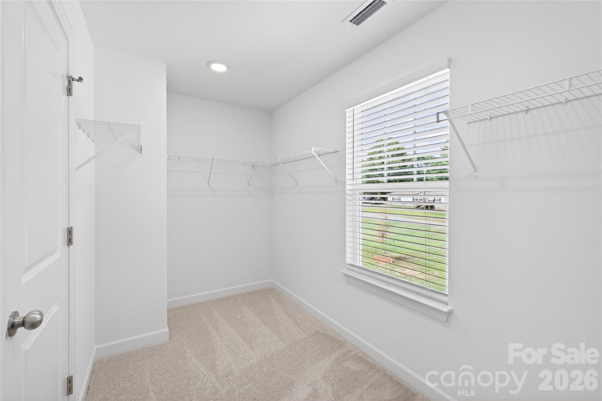 128 Overcash Road, Unit 7171 Troutman, NC 28166 - Photo 24 of 41 a view of an empty room with a window