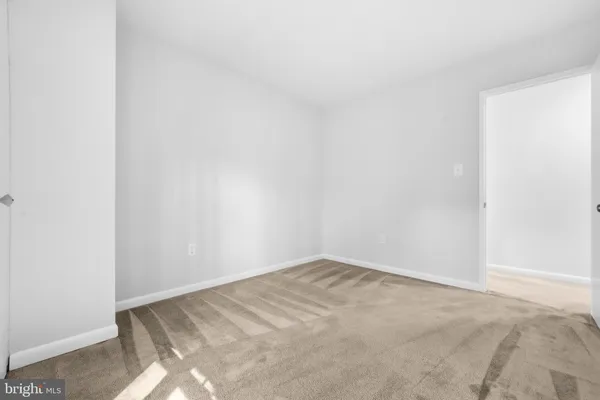a view of an empty room with a large window