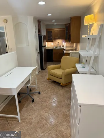 a living room with furniture and a rug