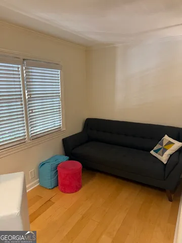 a living room with a couch and a window