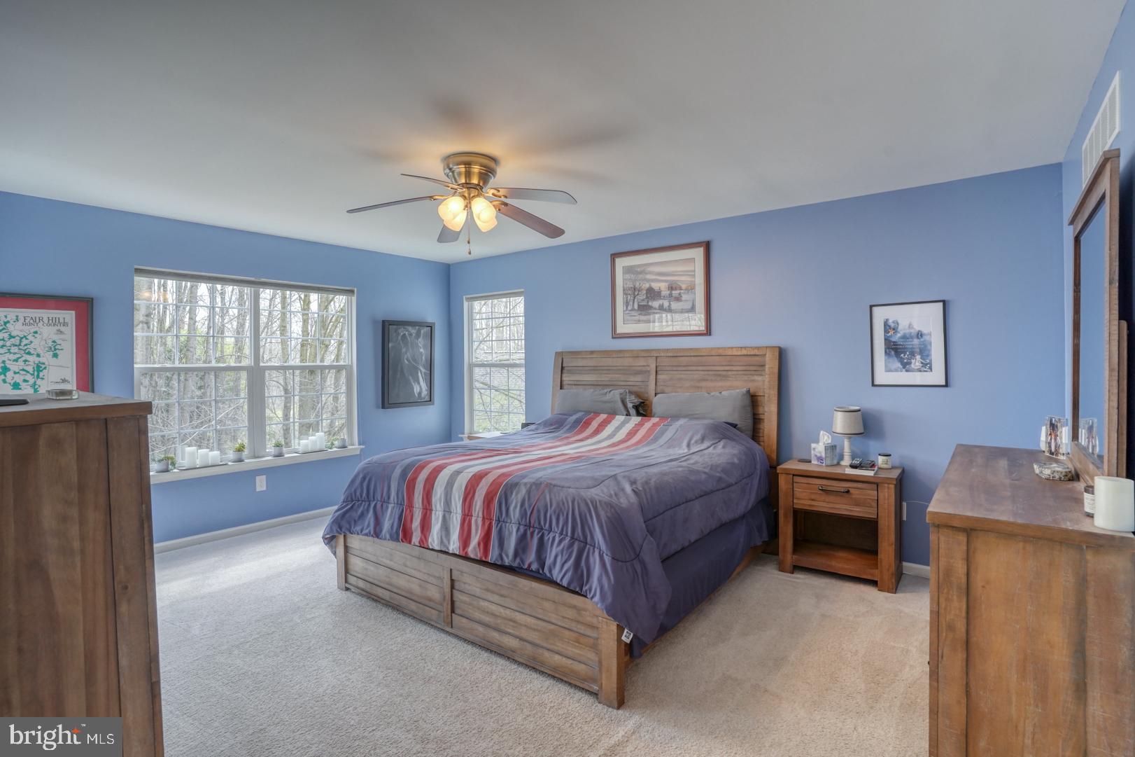 612 Sandy's Parish Road Landenberg, PA 19350 - Photo 30 of 49 a spacious bedroom with a bed and a chandelier